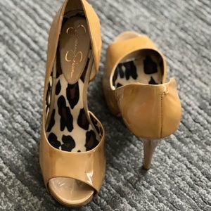 Gently used patent leather heels. Worn twice, has a spot.